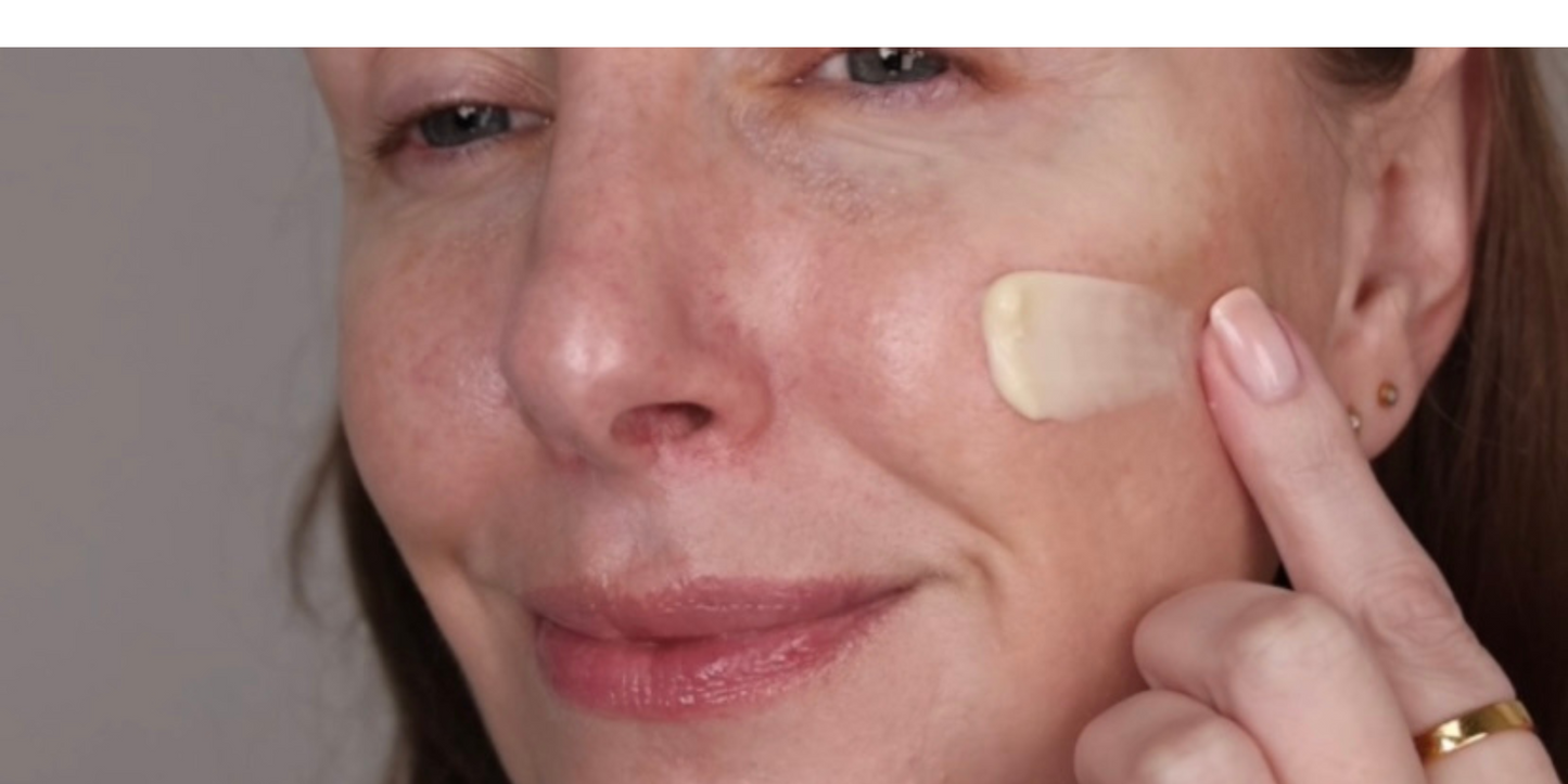 Lady with Radiance Moisturiser on her cheek