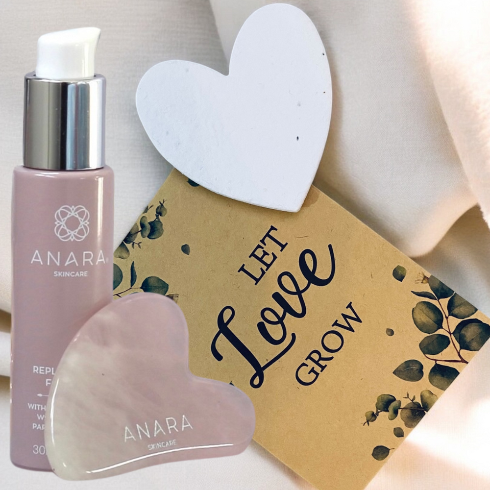 
                  
                    Anara Skincare Replenishing Face Oil, Rose Quartz Gua Sha and heart seed paper with a let love grow envelope on a cream fabric
                  
                