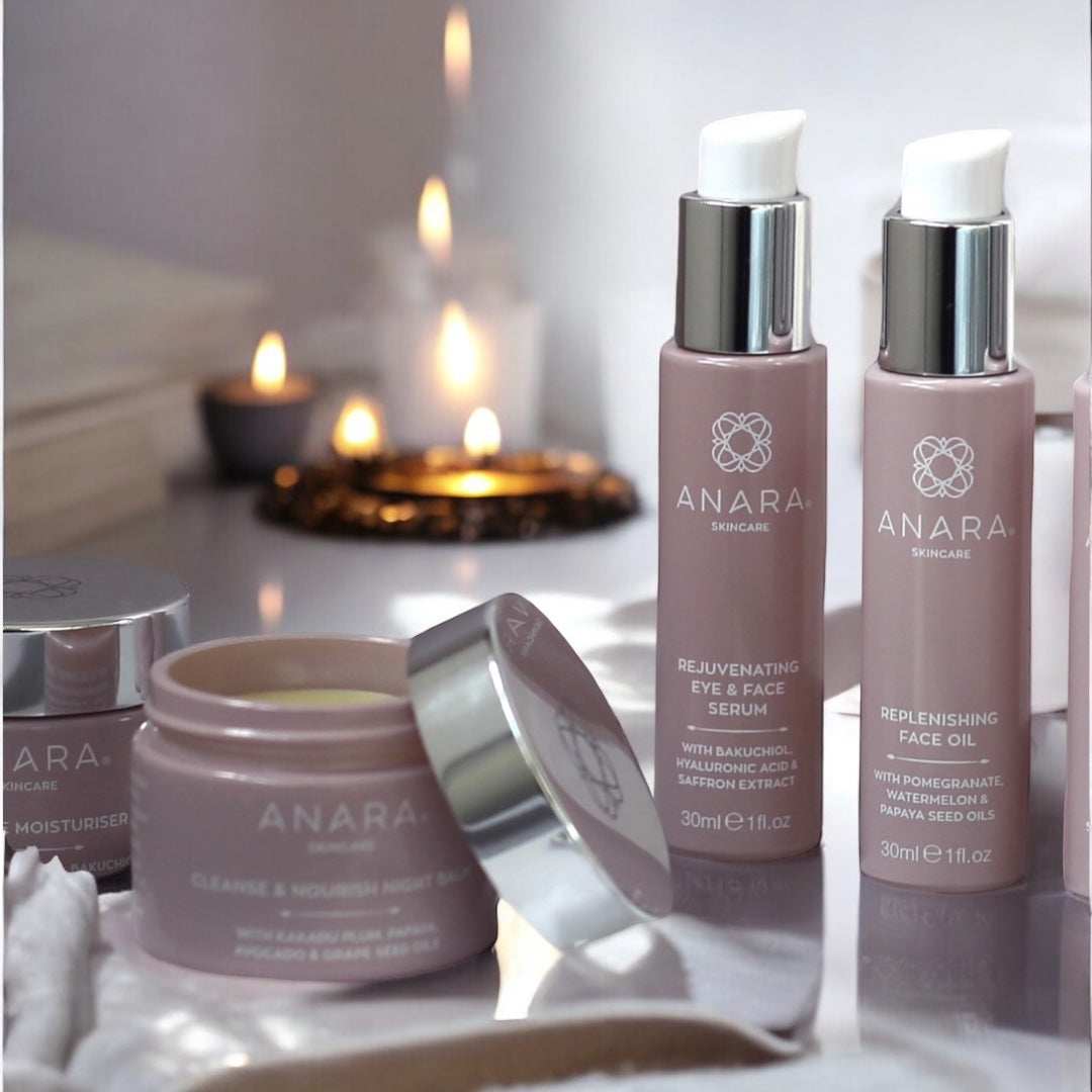 Anara Skincare Balm, Serum and Oil with candles in a spa setting