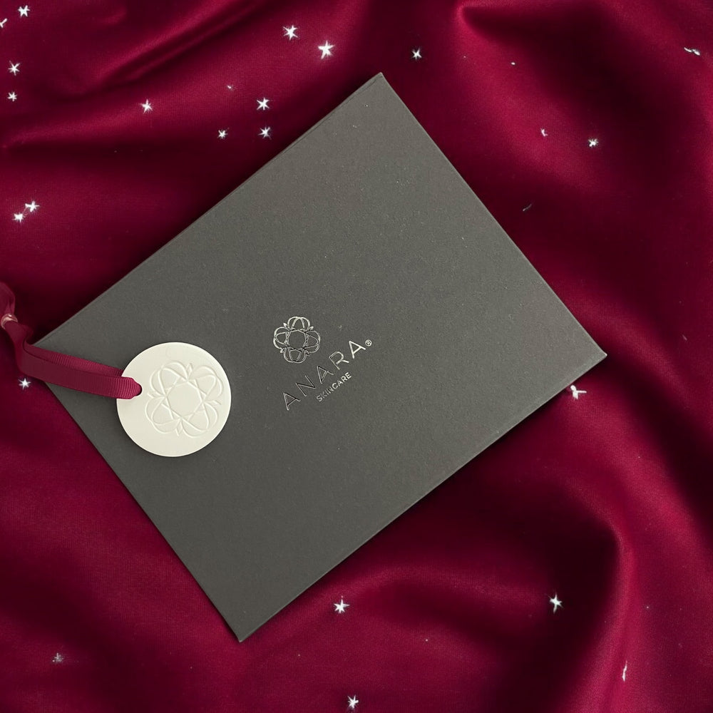 
                  
                    Anara Skinacre Magnetic Gift Box with Keep Sake Emblem on a Burgundy material with twinkling stars
                  
                