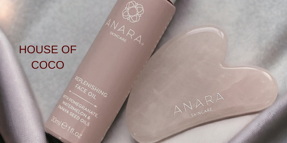 Anara Replenishing Face Oil & Rose Quartz Gua Sha on silver grey material